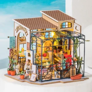 Rolife Emily's Flower Shop Miniature House. The western-designed exterior features decorative artwork and plants and a glassed-in patio.