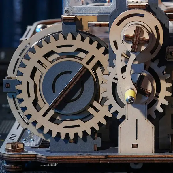 Close-up view of the gear engagement transmission in the ROKR Marble Spaceport 3D Wooden Puzzle.